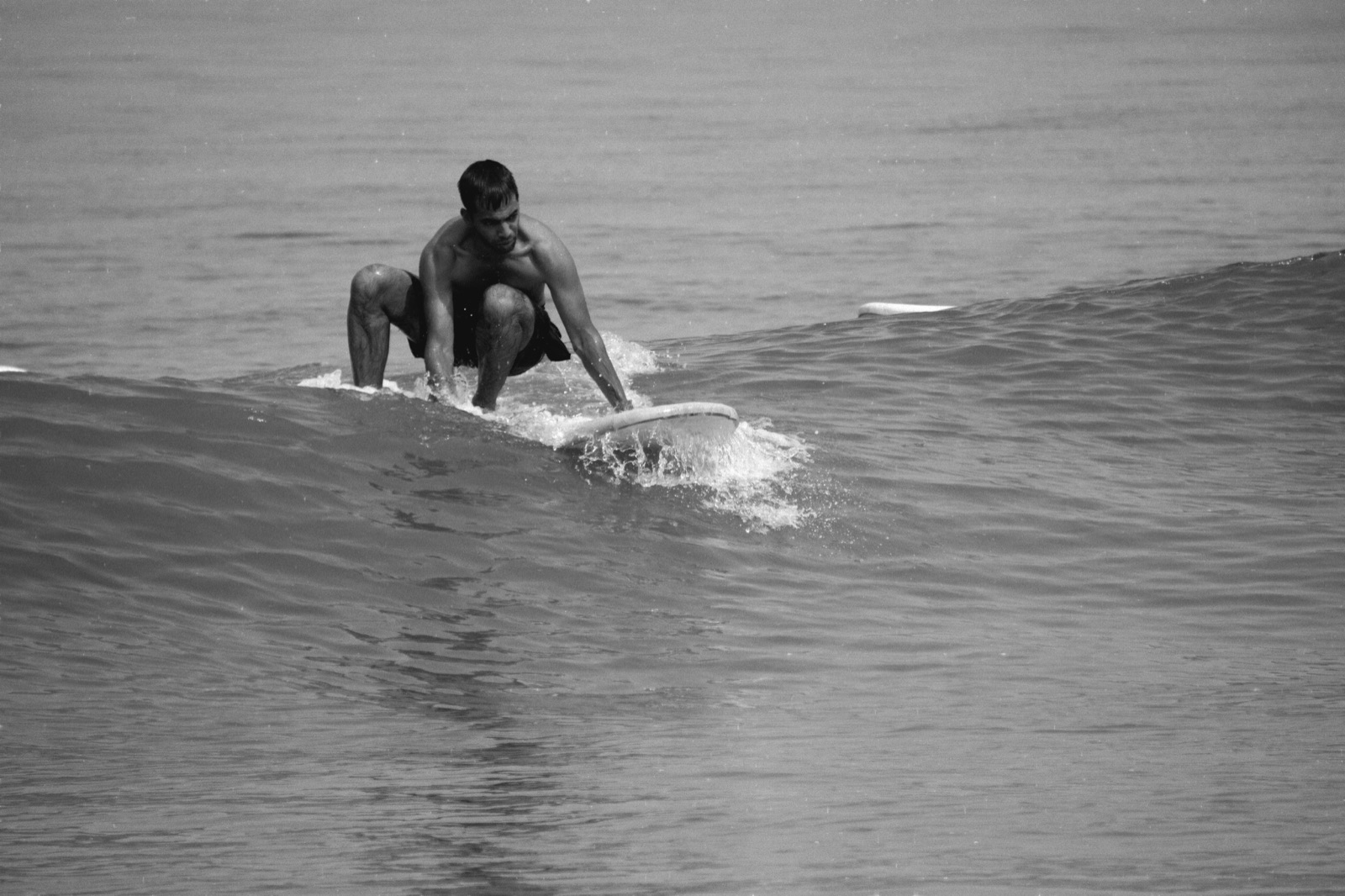 Vikram Singh Kushwaha surfing — black and white full-frame action shot
